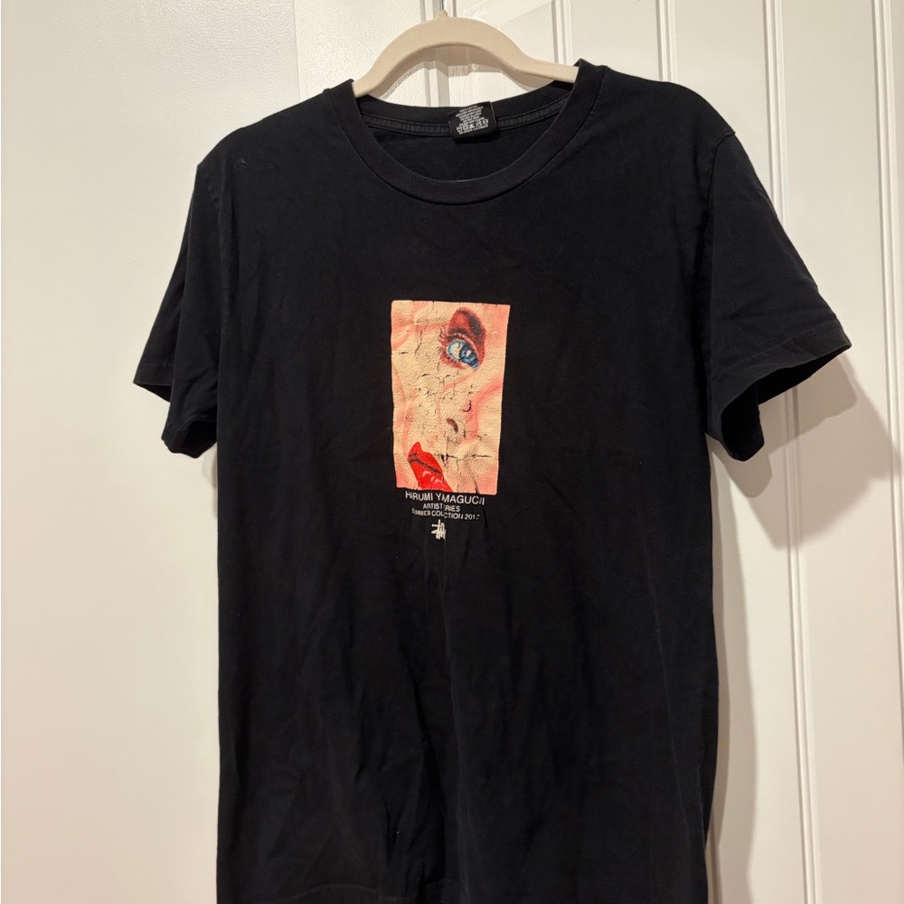 Vintage Stussy Black Tee with Artistic Graphic